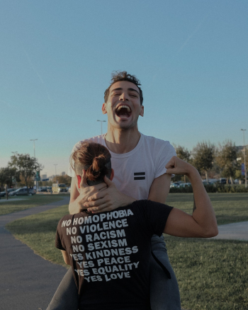 Photo of Man Carrying Another Man Photo of Man Carrying Another Man
