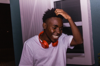 Photo of Man Laughing While Scratching His Head Photo of Man Laughing While Scratching His Head