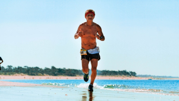 Photo Of Man Running On The Beach Photo Of Man Running On The Beach