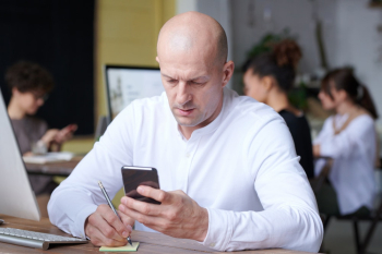 Photo Of Man Using Smartphone Photo Of Man Using Smartphone