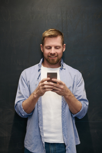 Photo Of Man Using Smartphone Photo Of Man Using Smartphone