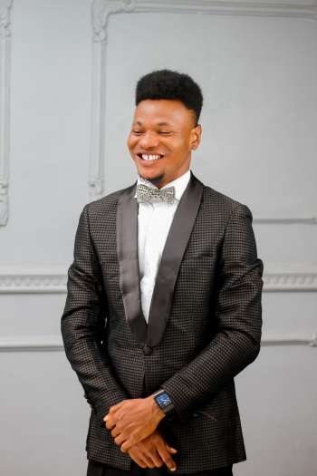 Photo of Man Wearing Formal Coat and Bow Tie Photo of Man Wearing Formal Coat and Bow Tie