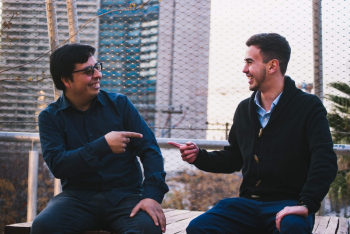 Photo of Men Pointing To Each Other Photo of Men Pointing To Each Other