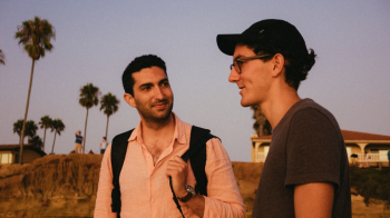 Photo of Men Talking With Each Other Photo of Men Talking With Each Other