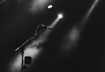 photo of microphone on foggy stage photo of microphone on foggy stage