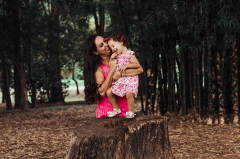 Photo Of Mother Holding Her Child Photo Of Mother Holding Her Child