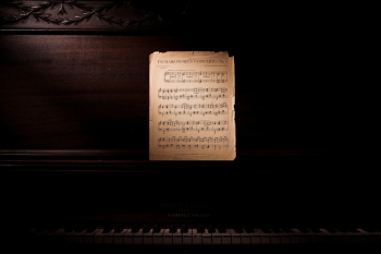 Photo Of Music Notes Leaning On Wooden Piano Photo Of Music Notes Leaning On Wooden Piano