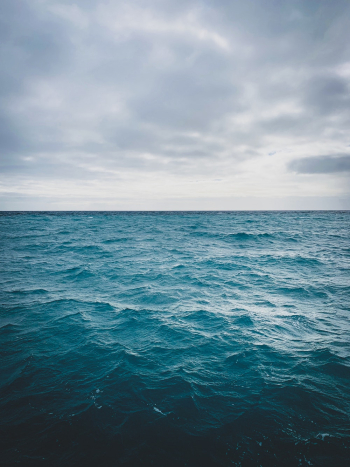 Photo of Ocean Under Cloudy Sky Photo of Ocean Under Cloudy Sky