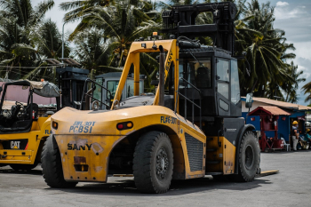 Photo of Parked Yellow Forklift Truck Photo of Parked Yellow Forklift Truck