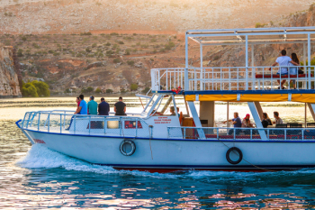 Photo of People Riding on Boat Photo of People Riding on Boat