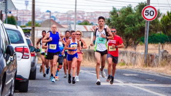 Photo of People Running Beside Parked Vehicles Photo of People Running Beside Parked Vehicles