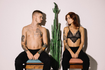 Photo Of People Sitting Beside Cactus Plant Photo Of People Sitting Beside Cactus Plant