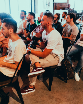 Photo Of People Sitting On Chairs Photo Of People Sitting On Chairs