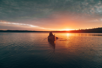 Photo of Person Riding Kayak Photo of Person Riding Kayak