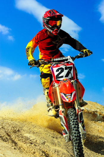 Photo of Person Riding Motocross Dirt Bike Photo of Person Riding Motocross Dirt Bike