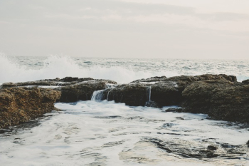 Photo of Rocks On Ocean Photo of Rocks On Ocean