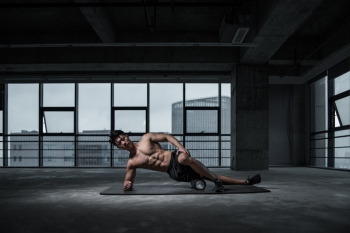 Photo of Shirtless Man Doing Yoga Photo of Shirtless Man Doing Yoga