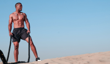 Photo of Shirtless Man Holding Rope Photo of Shirtless Man Holding Rope
