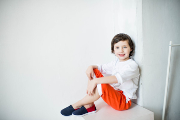 Photo of Smiling Boy Sitting