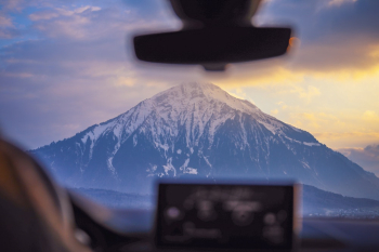 Photo of Snow Capped Mountain Through Windshield Photo of Snow Capped Mountain Through Windshield