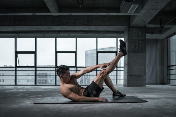 Photo of Topless Man Exercising on Yoga Mat Photo of Topless Man Exercising on Yoga Mat