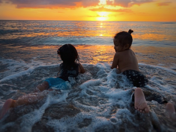 Photo of Two Girls in Beach during Golden Hour