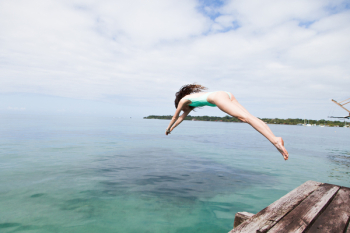 Photo of Woman Diving Into the Water Photo of Woman Diving Into the Water