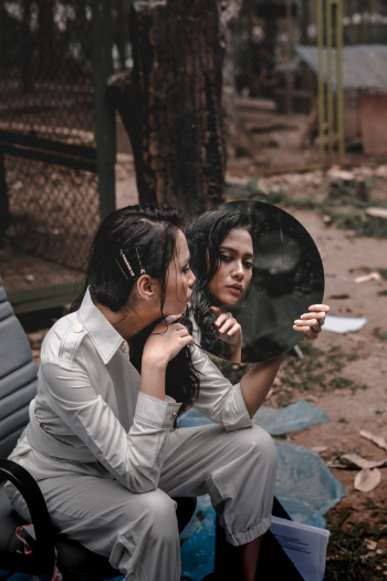 Photo of Woman Holding A Mirror Photo of Woman Holding A Mirror