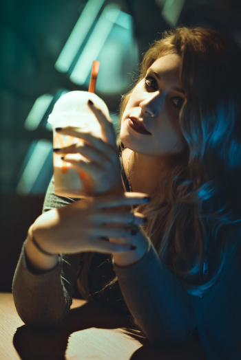 Photo of Woman Holding Plastic Cup