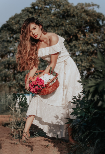 Photo of Woman Holding Wicker Basket