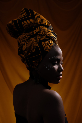 Photo of Woman in African Headscarf Posing Photo of Woman in African Headscarf Posing