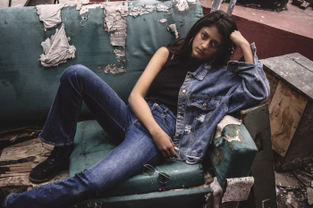 Photo of Woman Posing in Broken Sofa Photo of Woman Posing in Broken Sofa