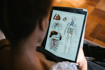 Photo Of Woman Studying Anatomy Photo Of Woman Studying Anatomy