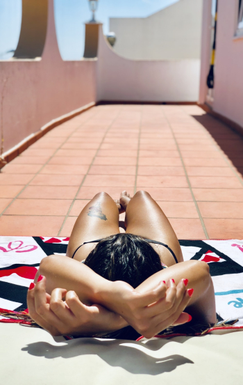 Photo of Woman Sun Bathing