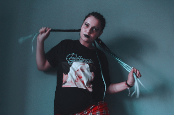 Photo Of Woman Wearing Black Graphic Shirt