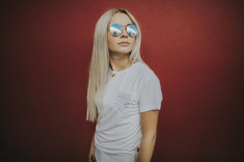 Photo of Woman Wearing Blue-lens Sunglasses Photo of Woman Wearing Blue-lens Sunglasses