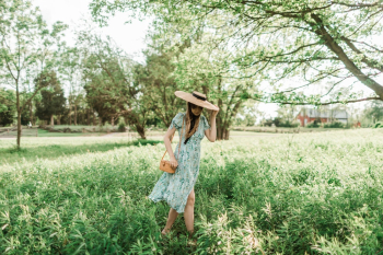 Photo of Woman Wearing Sun Hat Photo of Woman Wearing Sun Hat