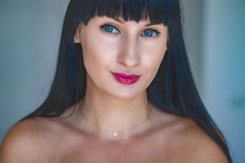 Photo of Woman With Blue Eyes and Black Hair