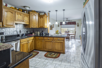Photo of Wooden Cabinets and Refrigerator Photo of Wooden Cabinets and Refrigerator