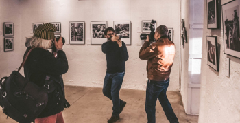 Photographers in a Photo Gallery Photographers in a Photo Gallery