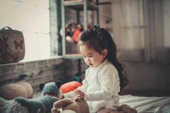 Photography of a Baby Girl Playing Photography of a Baby Girl Playing