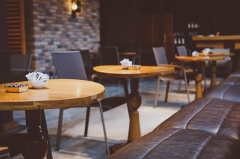 photography of brown pedestal table photography of brown pedestal table