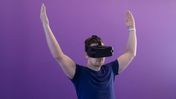 Photography of Man Using Virtual Reality Headset