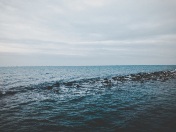 Photography of Ocean Under Cloudy Sky Photography of Ocean Under Cloudy Sky