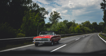 Photography of Red Car on Road Photography of Red Car on Road