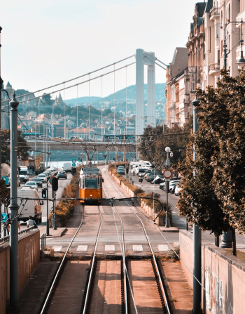 Photography of Tram Traveling on Road Photography of Tram Traveling on Road