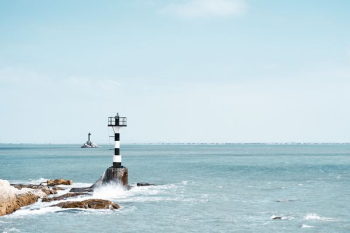 photography of white and black lighthouse photography of white and black lighthouse