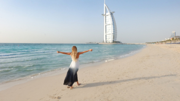 Photography of Woman Walking On Seashore Photography of Woman Walking On Seashore