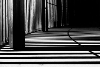pillar of building shadows grayscale photography pillar of building shadows grayscale photography