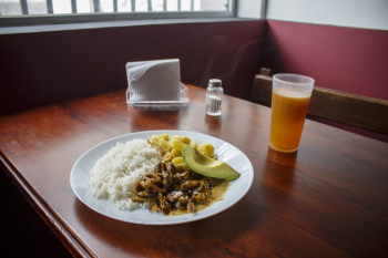 Plate of Cooked Rice With Cooked Beef Beside of Cup of Juice Plate of Cooked Rice With Cooked Beef Beside of Cup of Juice